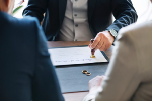 Signing a marriage certificate with rings